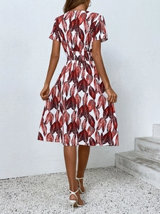 Back view of a summer A-line dress featuring red leaf prints and high elastic waist