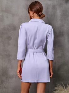 Rear view of a light purple blazer dress featuring three-quarter sleeves and a waist belt