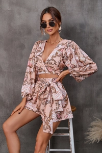 Detail of V-neck long sleeve floral crop top and high waist shorts with baroque print