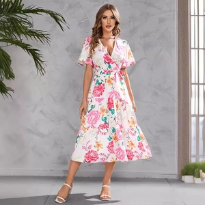 Floral V-neck summer midi dress with tie waist and ruffled tiered skirt on model