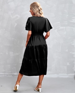 Detail view of the black V-neck tiered midi dress with flutter sleeves and satin luster