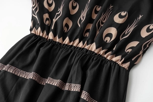 Detail of bohemian ethnic print and elastic pleated waist on black summer dress