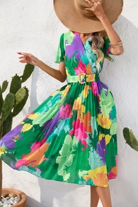 Detail of colorful floral pleated dress with V-neck and belted waist for summer style