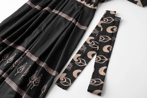 Detailed close-up of ethnic geometric print on fabric with matching patterned waist belt