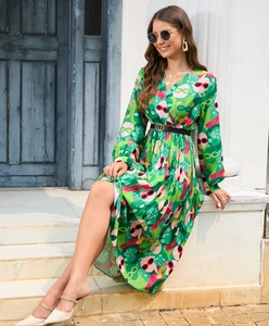 Detail of green floral maxi dress with v-neck and waist belt with golden buckle
