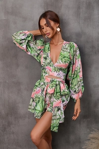 Detail of tropical floral print on a deep V-neck crop top and matching drawstring shorts