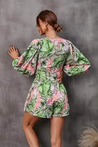 Back view of tropical leaf print pink romper with long puff sleeves and cinched waist