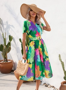 Detail of colorful floral midi dress with V-neckline and matching buckle belt