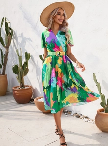 Detailed view of colorful abstract floral print and pleated chiffon skirt texture