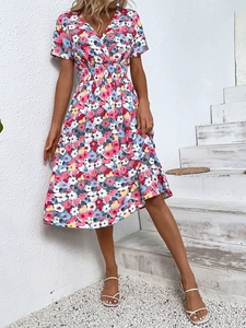 Detailed view of floral print dress with V-neckline and elastic high waist design