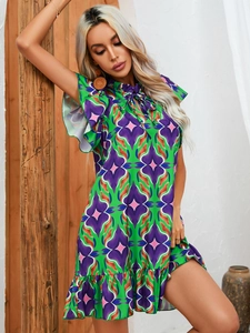 Detail of floral printed summer dress showing ruffle sleeves and neckline ties