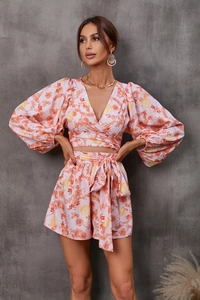 Detailed view of the floral lantern sleeves and waist tie on the V-neck two-piece set