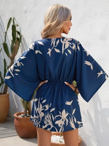 Detail view of summer dress back showing white leaf print on navy blue fabric