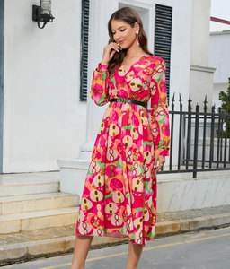 Detail of V-neck long sleeve dress with colorful geometric patterns and buckled belt