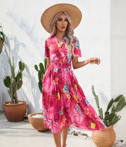 Detail of rose red tropical floral print dress with V-neck and belted waist design
