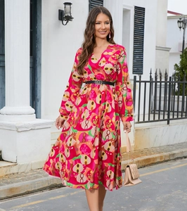 Detailed view of women's V-neck printed midi dress with long sleeves and black belt