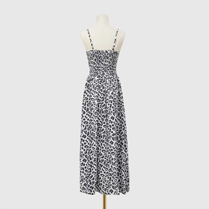 Detail view of the back of a leopard print maxi dress with elastic smocking