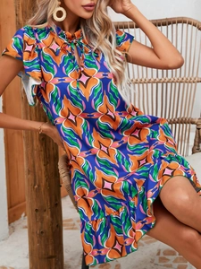 Detail of vibrant floral print summer dress with ruffled sleeves and a V-neckline