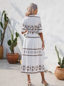 Back view of bohemian white maxi dress with brown ethnic print and matching belt