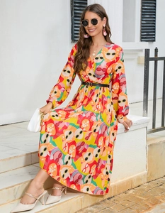 Detail of V-neck long sleeve maxi dress with vibrant floral print and waist belt