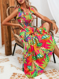 Detail of tropical palm print dress with smocked bodice and tied shoulder straps