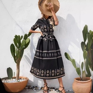 Ethnic print summer dress with short sleeves and waist belt for a resort style look