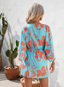 Back view of summer floral dress with leaf print, waist drawstring and half sleeves