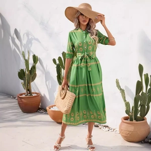 Green bohemian mid-length summer dress with half sleeves and geometric floral patterns