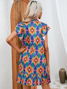 Back view of summer floral print dress with ruffle trim and bohemian geometric patterns