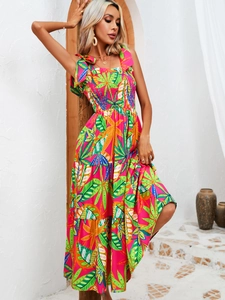 Detail of tropical leaf print on tiered maxi dress with ruched bust and tie straps