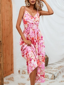Detail of pink floral print maxi dress with halter V-neck and ruffled hem design