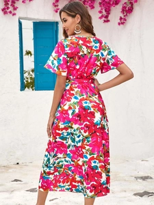 Floral print summer maxi dress with vibrant pink patterns and stylish side slit detail