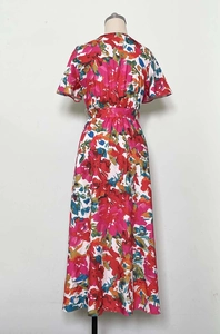 Detail view of the V-neck back design and waist pleats on a floral maxi summer dress
