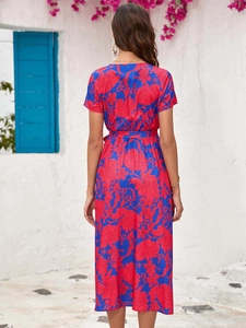Back view of a summer floral midi dress featuring a waist tie and light fabric