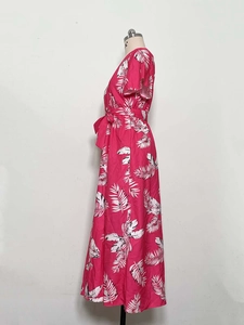 Detail of fuchsia tropical palm leaf print summer maxi dress with adjustable waist tie