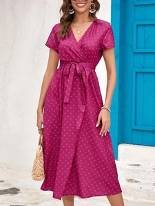 Detail view of purple floral wrap dress with V-neck, short sleeves and waist tie belt