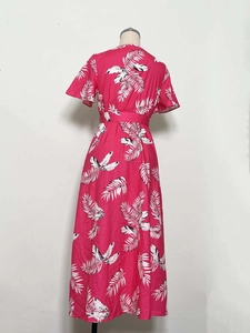 Back view of summer midi dress with tropical palm leaf print and waist design