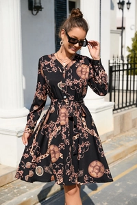 Detail of vintage baroque print maxi dress with V-neck and button-down front design