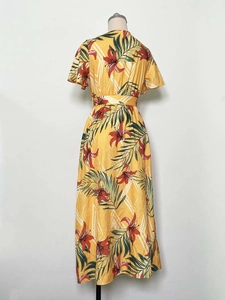 Detail of yellow tropical floral midi dress with V-neck, waist belt and ruffle sleeves