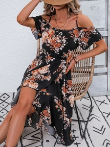 Detail of bohemian floral print dress featuring cold shoulder ruffles and thin straps