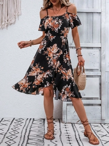 Detail of bohemian black floral dress showing off-shoulder neckline and ruffle sleeves