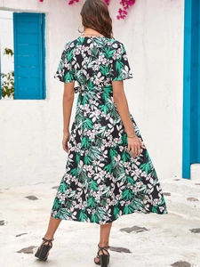 Detailed back view of a floral mid-length dress with a V-neckline and waist tie detail