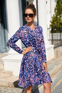 Close-up of leopard print dress detailing purple-blue patterns and button neckline