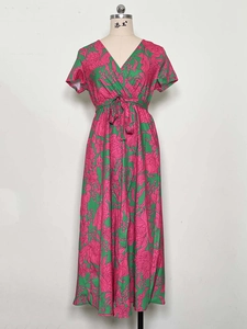 Detail showing deep V-neck and drawstring waist on pink floral summer midi dress