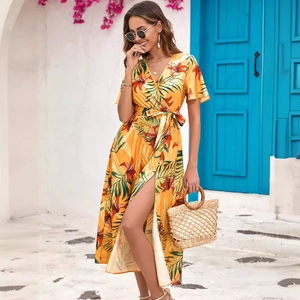 Yellow tropical floral wrap midi dress with V-neck and high slit for summer beach vacation