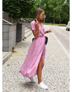 Detail of a purple summer wrap dress with orange floral print, V-neck and side slit