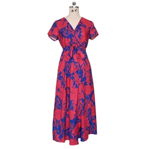 Short sleeve V-neck wrap dress with red tropical floral print on a blue background