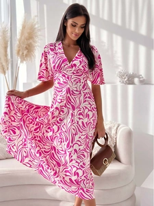 Detail of V-neck summer dress with magenta scroll print and elegant puff sleeves