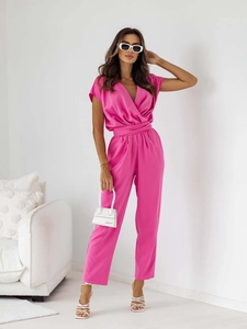 Close-up of magenta V-neck jumpsuit with waist tie and fluid straight leg design