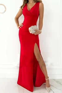 Detailed view of high side slit and wrap waist on a red V-neck sleeveless dress